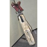 A set of metal shaft golf clubs,