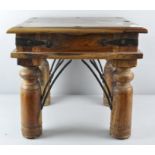 An Indian wooden side table,