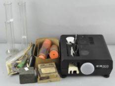 A collection of scientific equipment mainly test tubes.