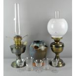 A collection of assorted wares including two oil lamps,