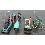 A Bosch electric lawn mower and two electric rotovators,