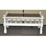 A white painted wooden glass topped coffee table,