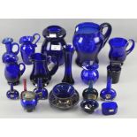 A collection of assorted blue glassware vases, jugs and more by Bristol blue,