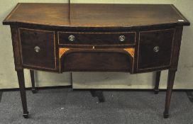 An Edwardian mahogany and inlay bow front sideboard having two central drawers