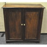 A 19th century mahogany plain two door side cabinet, raised on shaped bracket feet,