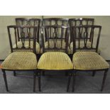 A set of six Regency style mahogany dining chairs with pierced vase splats,