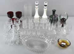 A collection of glassware including a paperweight and drinking glasses and other glassware