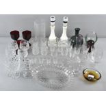 A collection of glassware including a paperweight and drinking glasses and other glassware