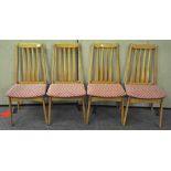 A set of four 20th Century beech wood dining chairs,