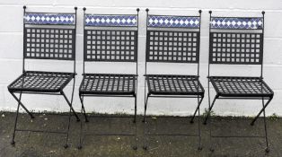 Four folding chairs with tile mosaic decoration