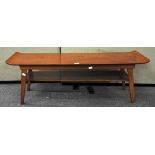 A 1960's stained beech veneered surf board coffee table with under shelf,