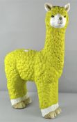 A resin Alpaca garden ornament, in yellow,