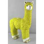 A resin Alpaca garden ornament, in yellow,