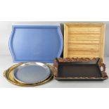 A group of assorted trays, to include an oval gilt composition one, 33cm x 45cm, a carved wood,