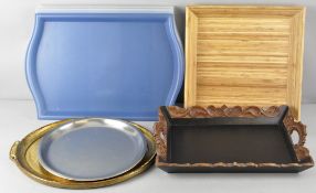 A group of assorted trays, to include an oval gilt composition one, 33cm x 45cm, a carved wood,