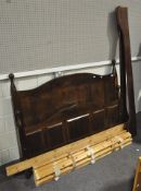 A set of stained pine double bed frame,