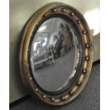 An antique style convex round mirror with gilt frame,