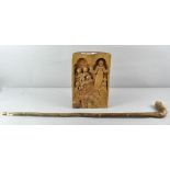 A chestnut log, relief carved with a scene of a Priest conducting Mass,