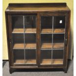 A 1940's oak and leaded glass bookcase display cabinet. Measures; 107cm x 89cm.