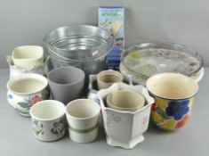 A collection of assorted ceramic planters, buckets and a glass plate.