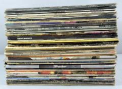 A collection of assorted vinyls, mainly rock, to include : Steely Don, Blackfoot,