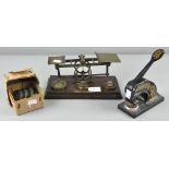 A set of early 20th century letter scales with wooden base,