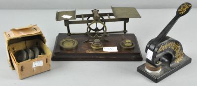 A set of early 20th century letter scales with wooden base,