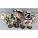 A collection of Toby Jugs and bird figures, including Royal Doulton 'Mine Host' Toby jug, 18cm high,