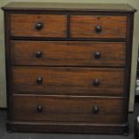 A Victorian mahogany two over three chest of drawers, flared top,
