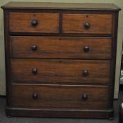 A Victorian mahogany two over three chest of drawers, flared top,