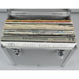 A metal case containing a collection of Vinyl LP's, including The Beatles please,