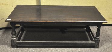 An oak coffee table. Measures; 34cm x 103cm x 57cm.