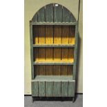 An unusual green painted three tier bookcase,