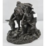 A Bronzed resin style sculpture of a Prospector taking a rest and feeding his donkey,
