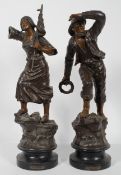 A pair of late 19th century French patinated Spelter figures of fisher folk,