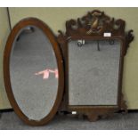 An 18th century mahogany and gilt finish Hoho bird mirror with pierced central motif