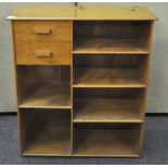 A 1970's bespoke made golden Oak veneer bookshelf with two draws,