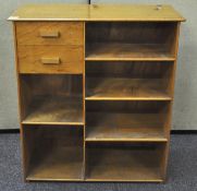A 1970's bespoke made golden Oak veneer bookshelf with two draws,