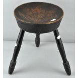 A poker work stool with three legs,