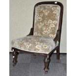 A Victorian mahogany upholstered nursing chair. Measures; 96cm.