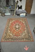 A large Samira super carpet having a red ground, central medallion and floral border,