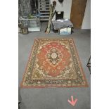 A large Samira super carpet having a red ground, central medallion and floral border,