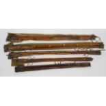 A collection of vintage fishing rods (split cane), including wooden and wooden and malacca examples,