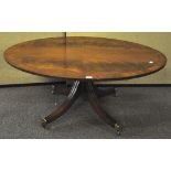 A regency style mahogany veneered oval coffee table,