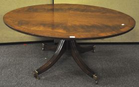 A regency style mahogany veneered oval coffee table,