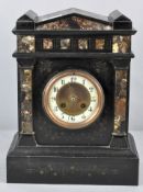 A slate and marble mantel clock having Arabic enamel chapter ring and pointed pediment atop.