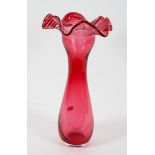 A large Victorian cranberry glass baluster vase, circa 1900, with frilled rim,