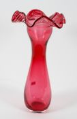 A large Victorian cranberry glass baluster vase, circa 1900, with frilled rim,