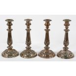 A set of four Victorian Sheffield plate candlesticks, late 19th century,