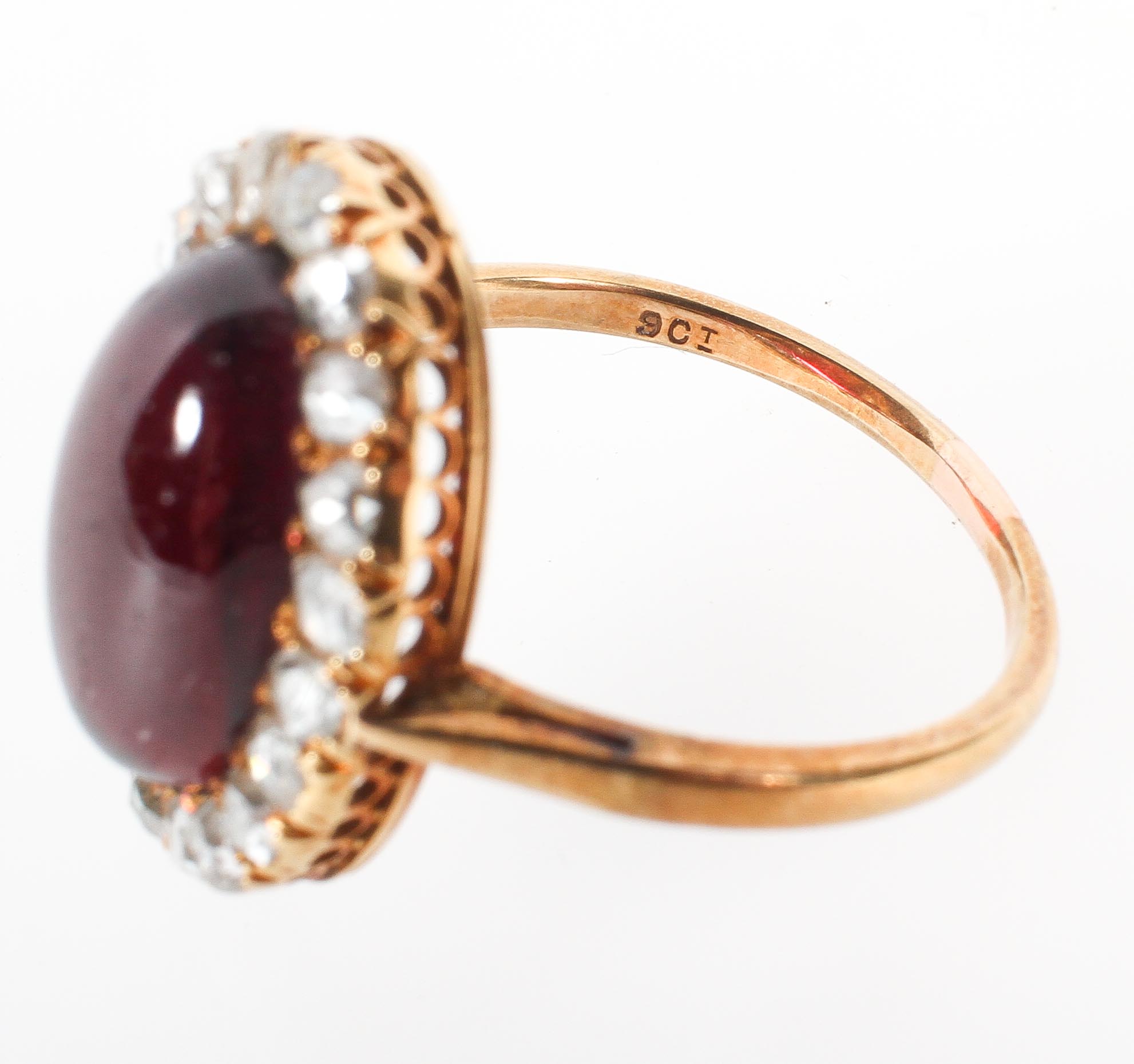 A yellow metal cluster ring principally set with a cabochon cut garnet and surrounded by rose cut - Image 3 of 3